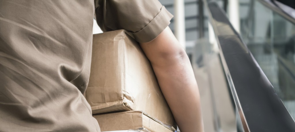 Postman carrying parcels