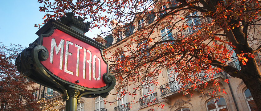 Paris Metro sign in autumn