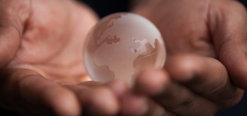 Man holding globe in his hands