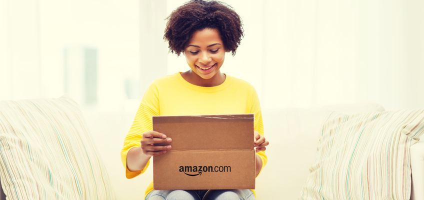 happy woman opening up Amazon.com package