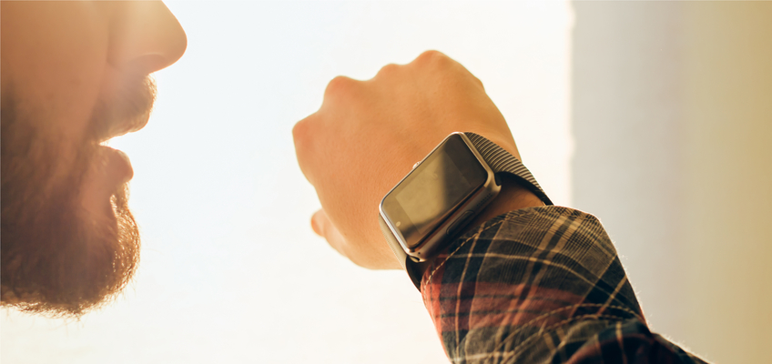 Man using voice search on his smart watch