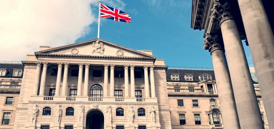 UK bank with UK flag flying above