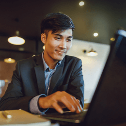 A Filipino freelancer using laptop